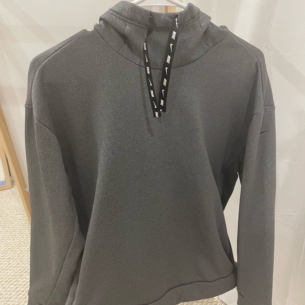 Small Gray Nike sweater. Lightly used, it has a front pouch hidden on the side.